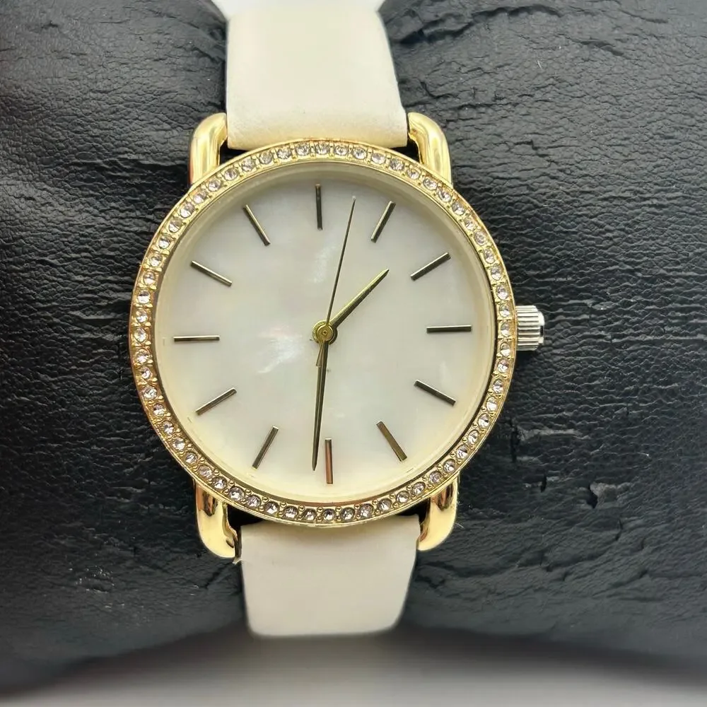 Women’s Gold-tone Crystal Bezel Mother Pearl Dial White Band Minimalist Watch